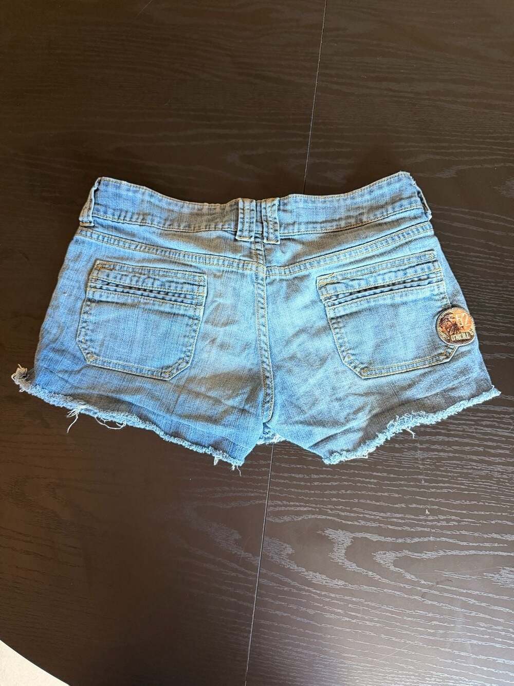 O'Neill Low Rise Cut Off Raw Hem Denim Micro Shorts with Palm Tree Patch